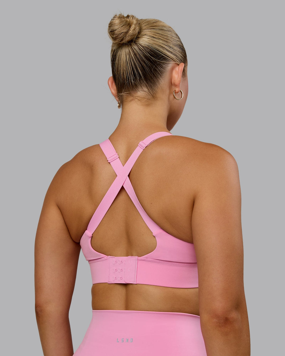 Woman wearing Accelerate Sports Bra - Bubblegum