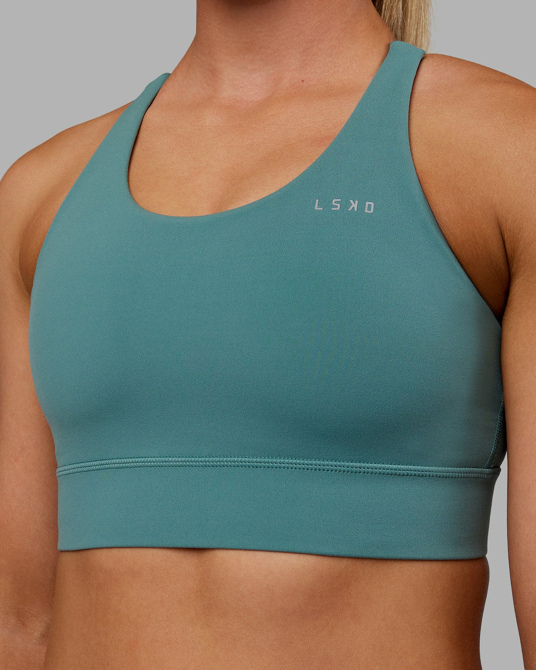 Woman wearing Accelerate Sports Bra - Sagebrush