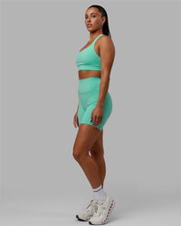 Woman wearing Advance Sports Bra - Aquatic Awe