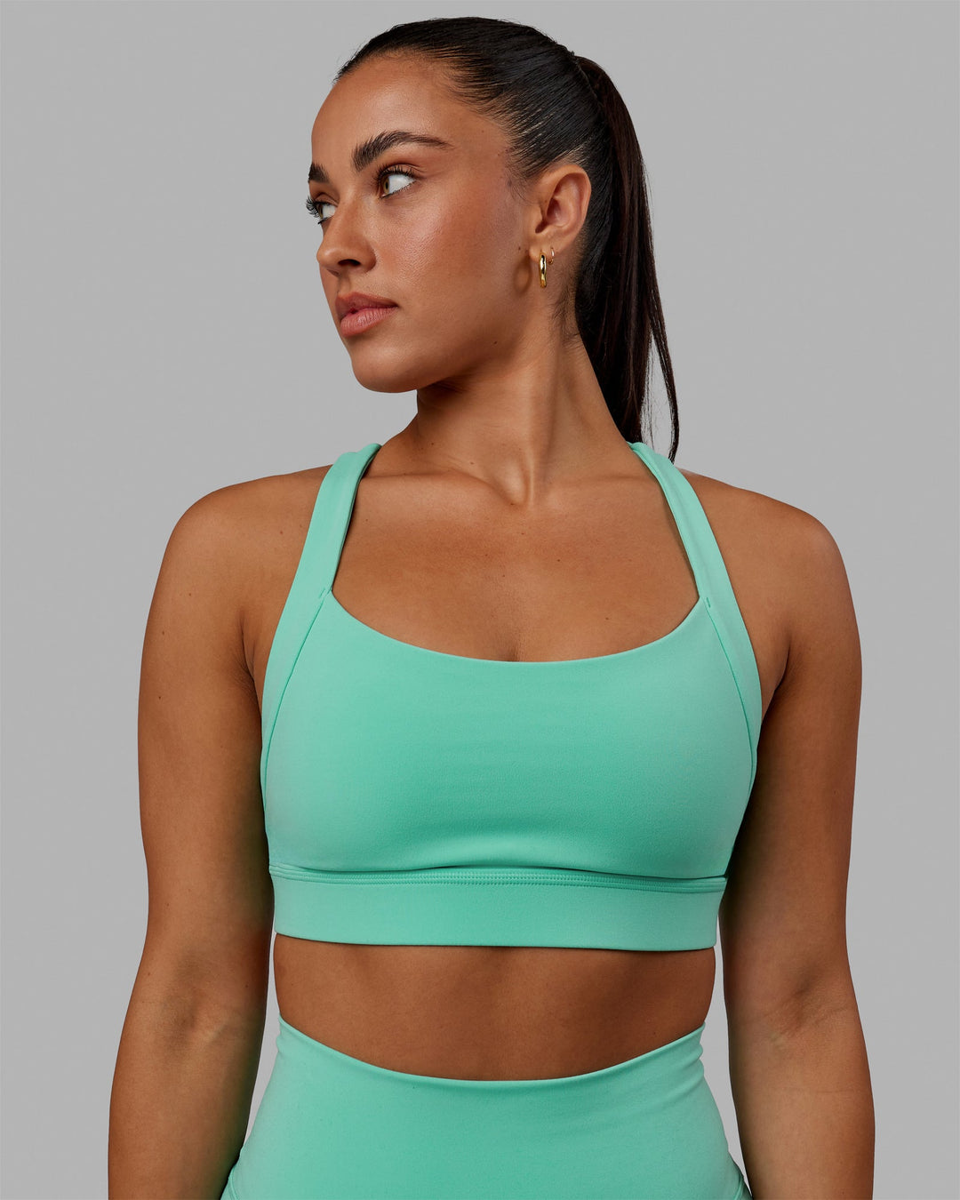 Woman wearing Advance Sports Bra - Aquatic Awe