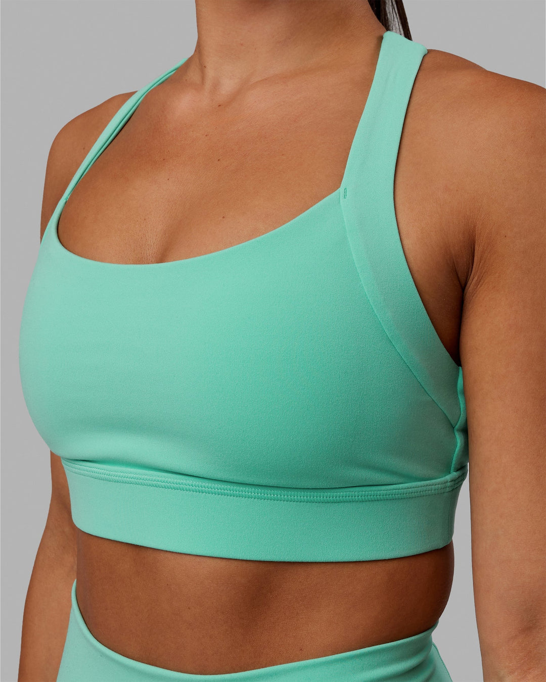 Woman wearing Advance Sports Bra - Aquatic Awe