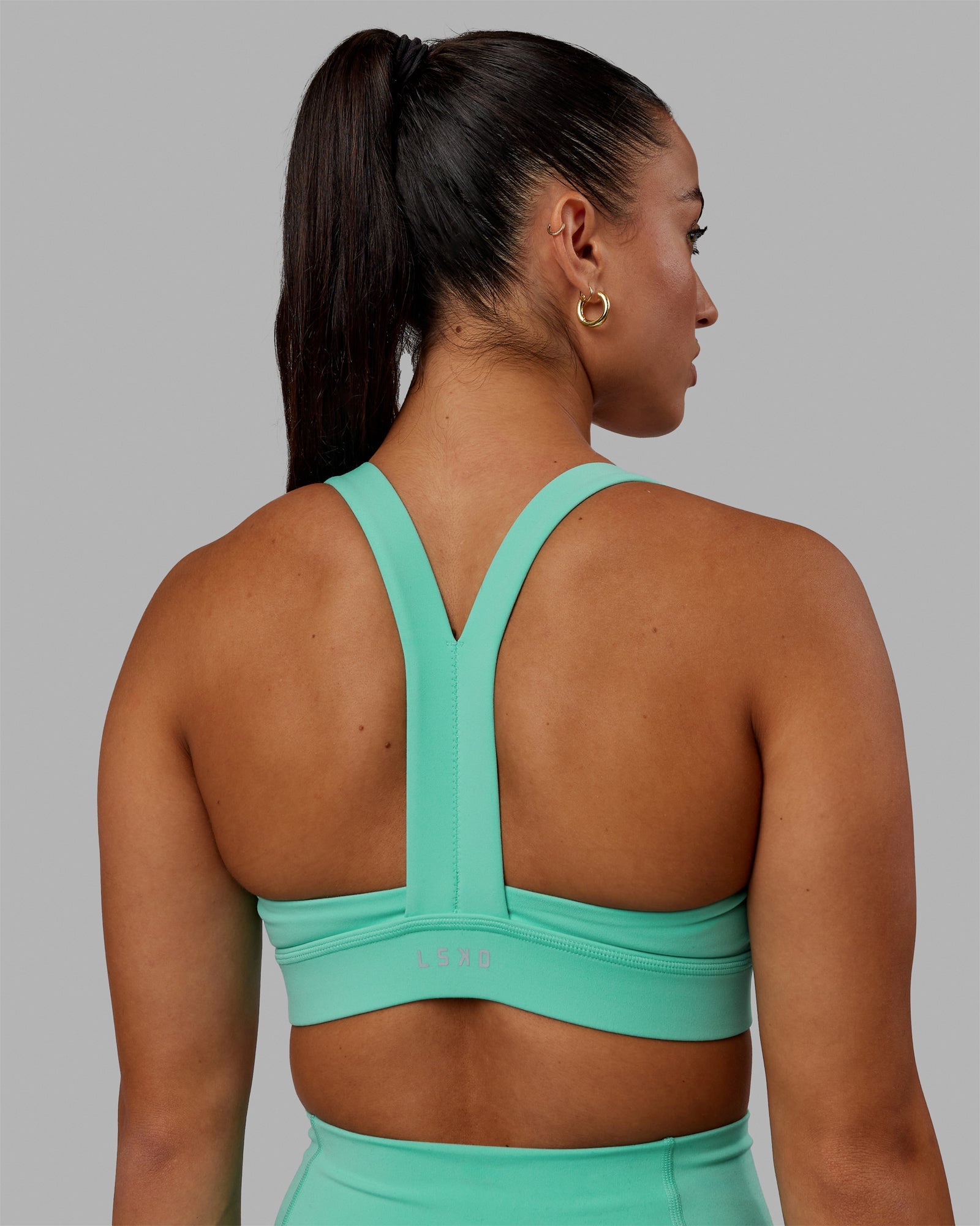 Woman wearing Advance Sports Bra - Aquatic Awe