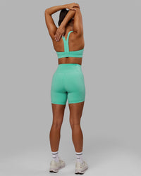 Woman wearing Advance Sports Bra - Aquatic Awe