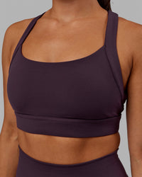 Woman wearing Advance Sports Bra - Midnight Plum