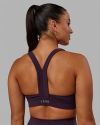 Woman wearing Advance Sports Bra - Midnight Plum