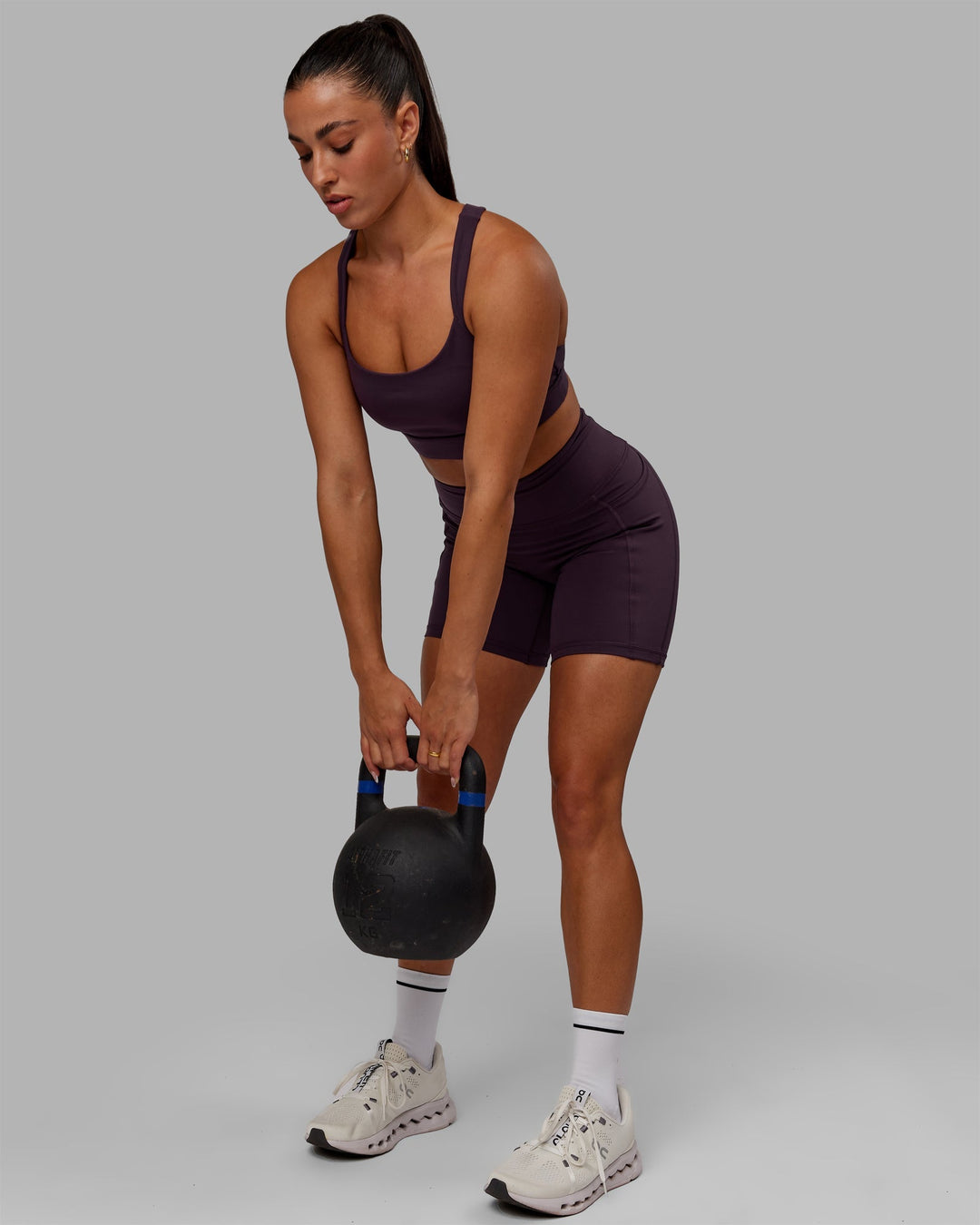 Woman wearing Advance Sports Bra - Midnight Plum