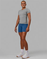 Woman wearing AeroFLX+ Seamless Tee - Light Grey Marl