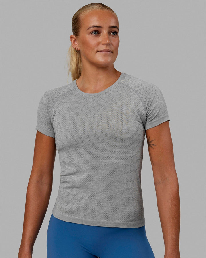 Woman wearing AeroFLX+ Seamless Tee - Light Grey Marl
