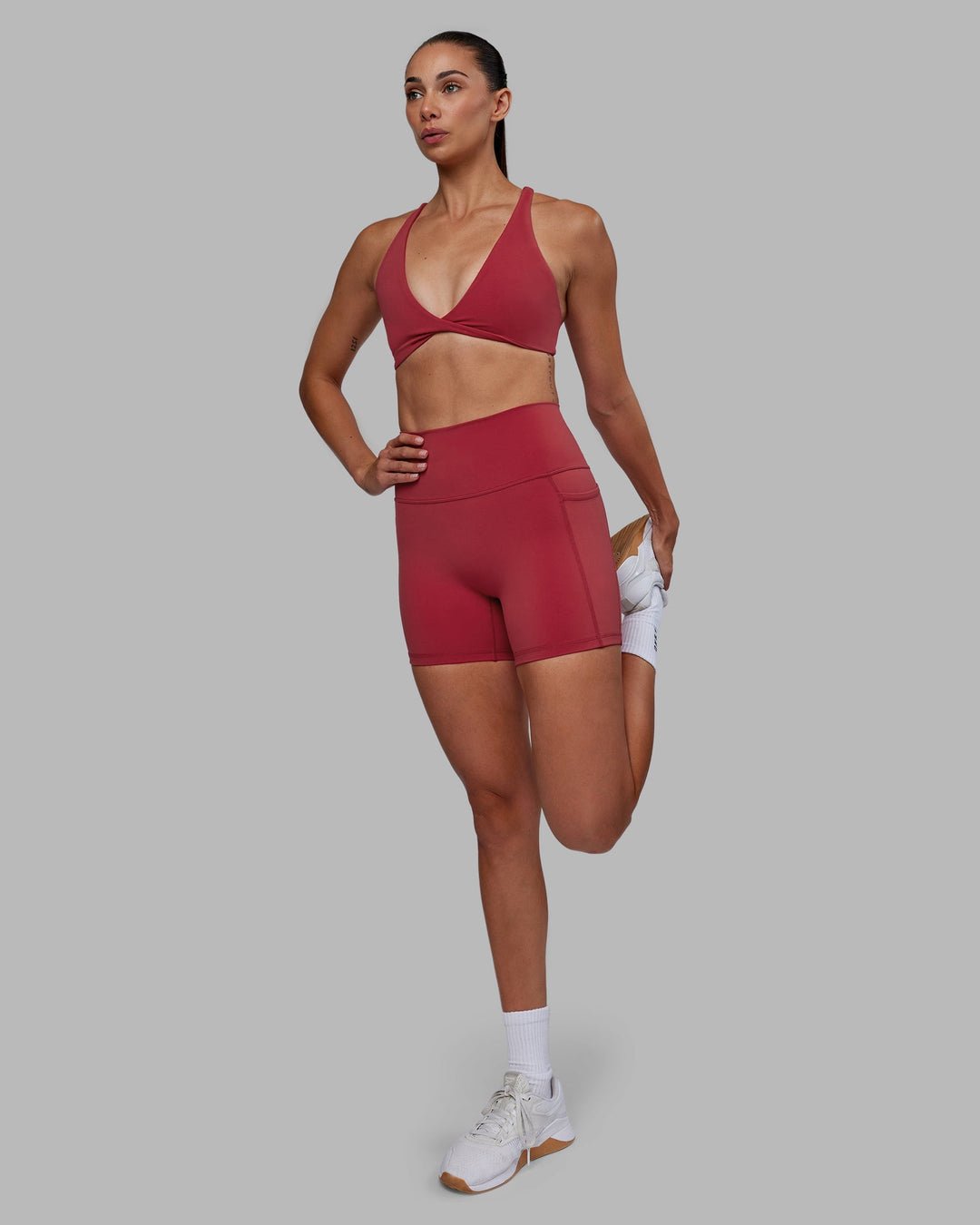 Woman wearing Agile Sports Bra - Claret