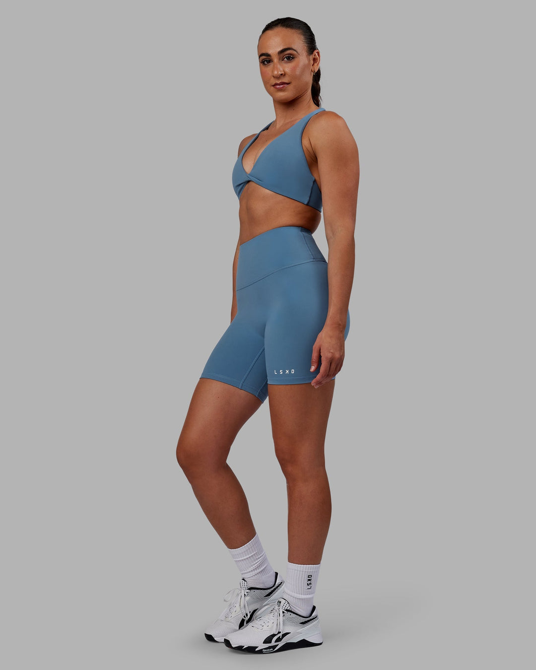 Woman wearing Agile Sports Bra - Elemental Blue