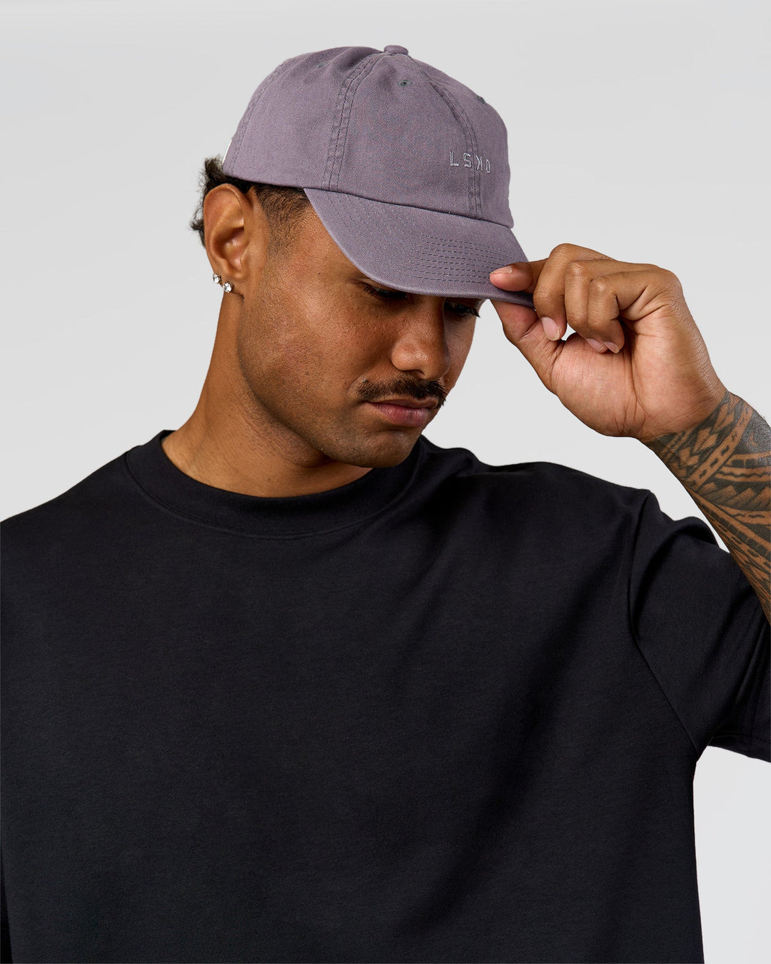 Man wearing All Day Cap in Duskstone