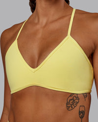 Woman wearing Ambience Sports Bra - Lemon Fizz