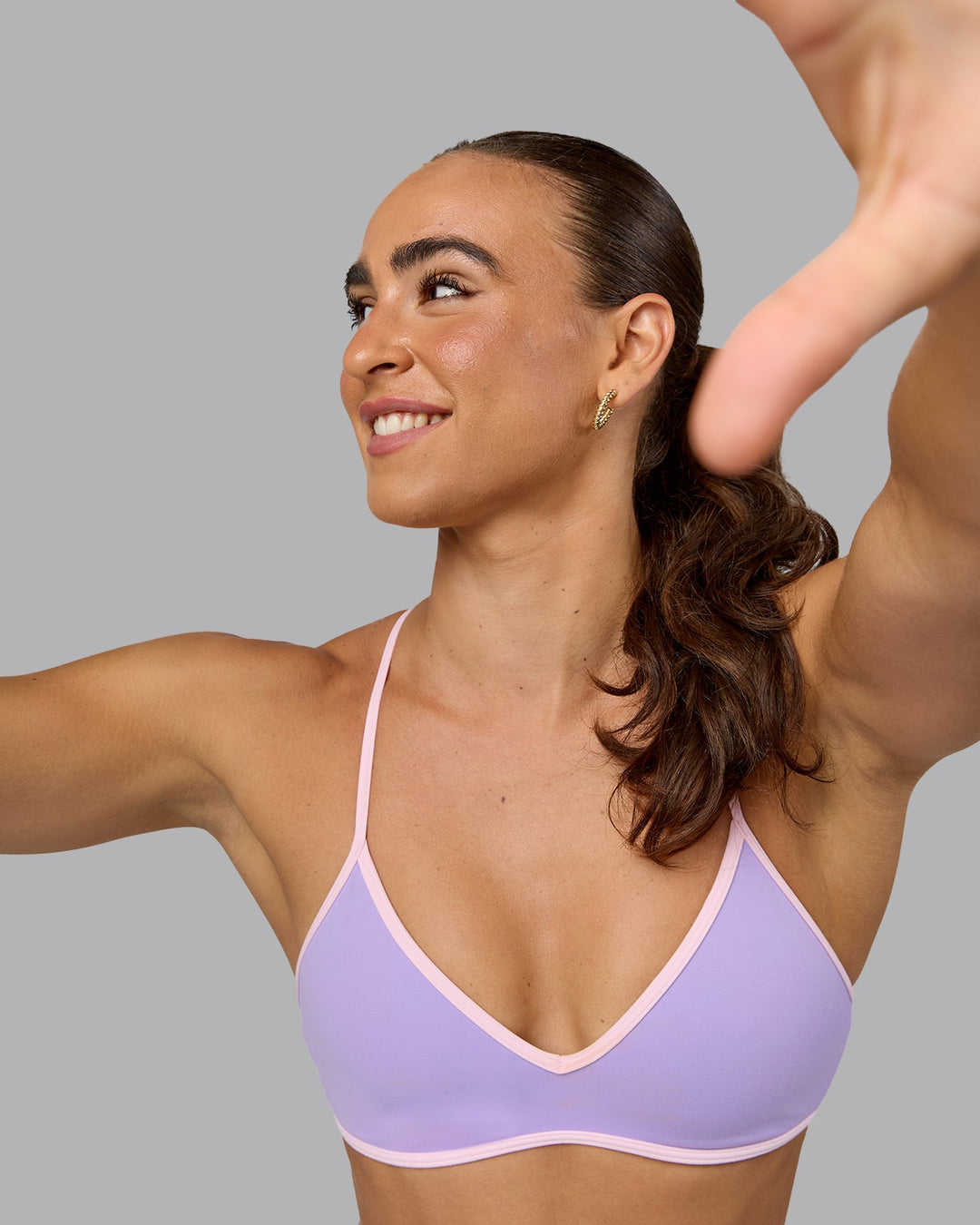 Woman wearing Ambience Sports Bra - Pale Lilac-Pale Pink