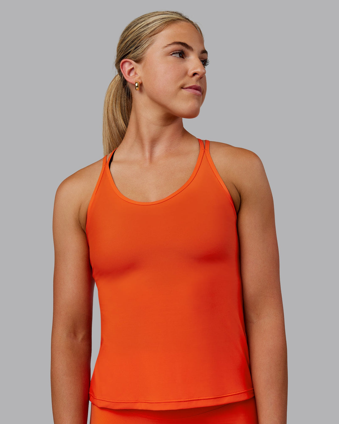 Woman wearing Apex Lightweight Performance Tank - Grenadine