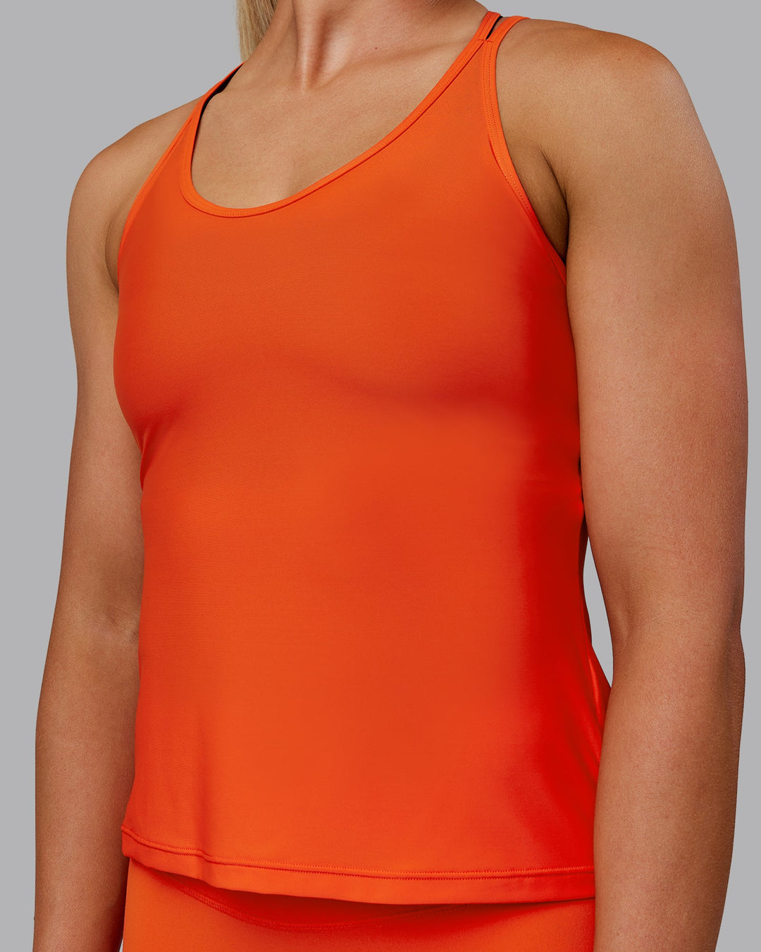 Woman wearing Apex Lightweight Performance Tank - Grenadine