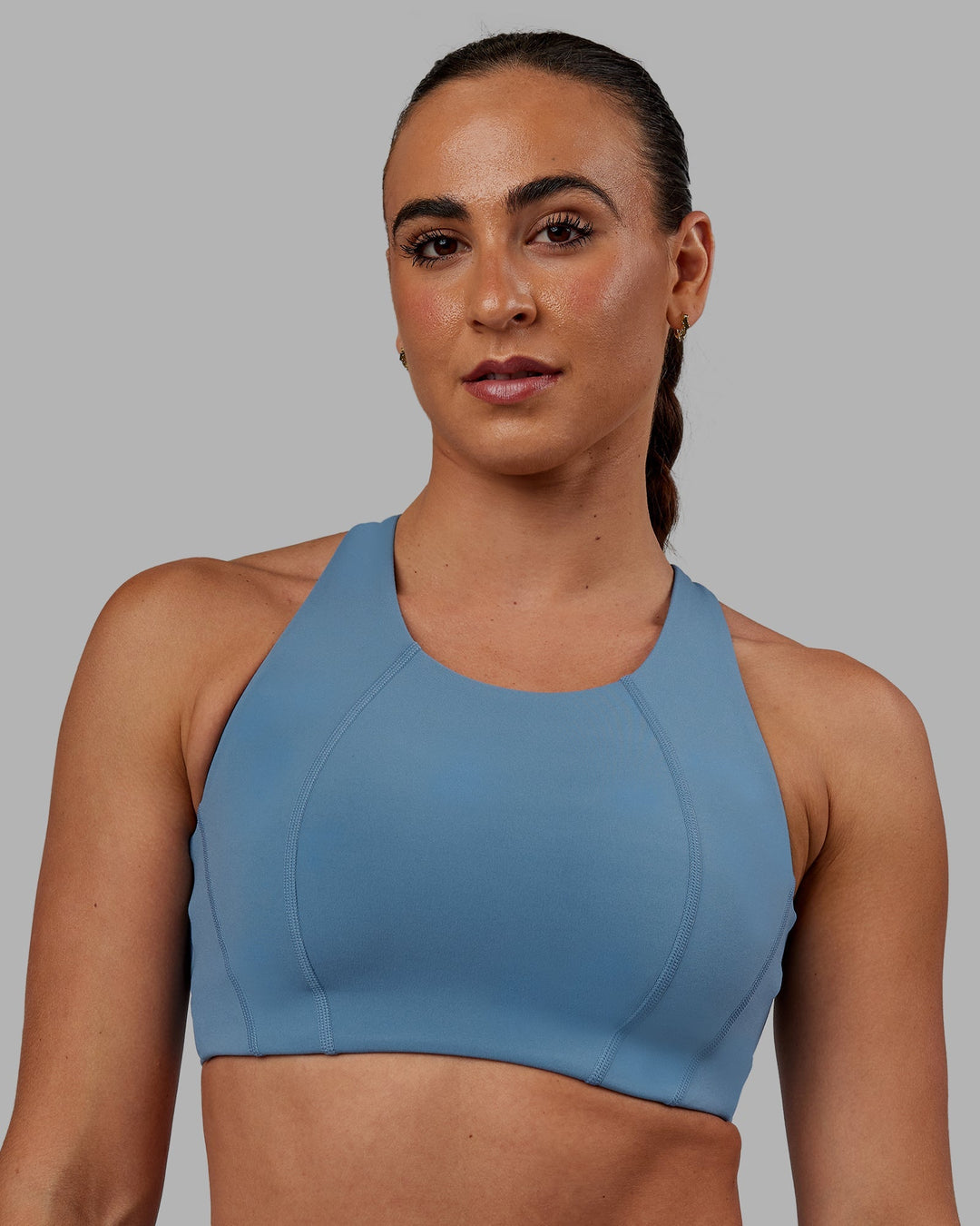 Woman wearing Ascent Sports Bra - Elemental Blue