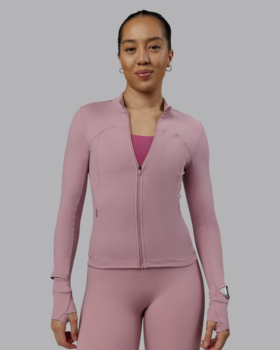 Woman wearing Aspire Jacket - Cosmetic Pink