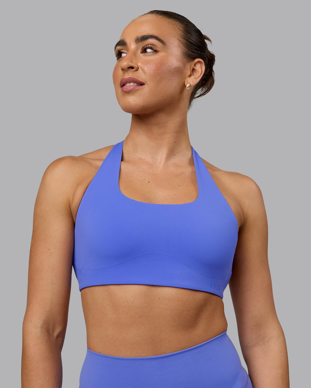 Woman wearing Aspire Sports Bra - Baja Blue