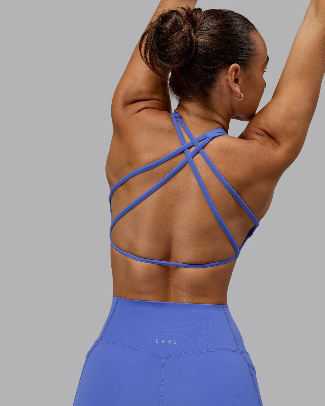 Woman wearing Aspire Sports Bra - Baja Blue