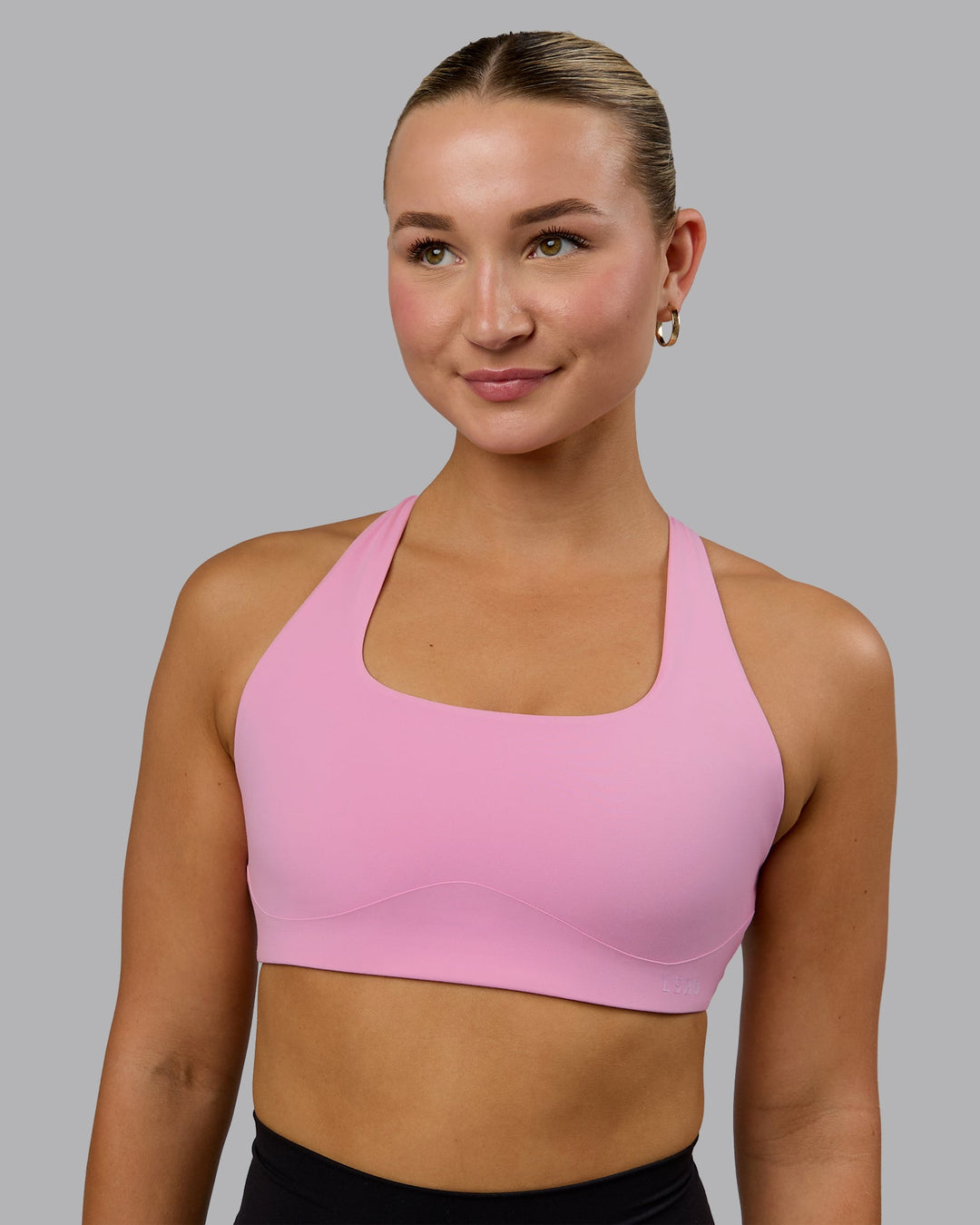 Woman wearing Aspire Sports Bra - Bubblegum