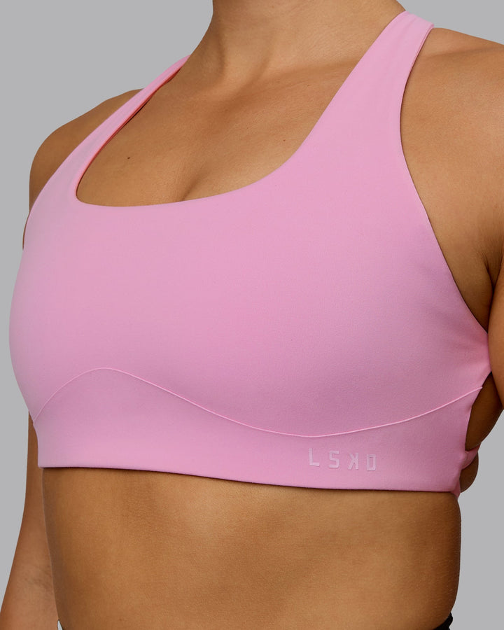 Woman wearing Aspire Sports Bra - Bubblegum
