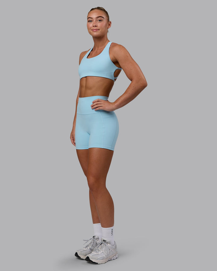 Woman wearing Aspire Sports Bra - Glacial Blue
