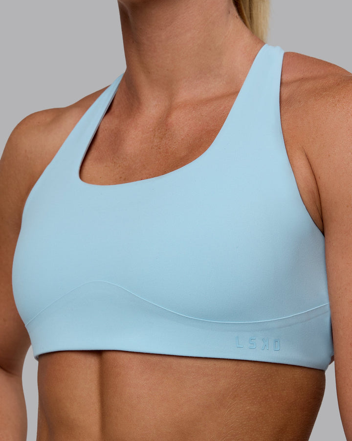 Woman wearing Aspire Sports Bra - Glacial Blue
