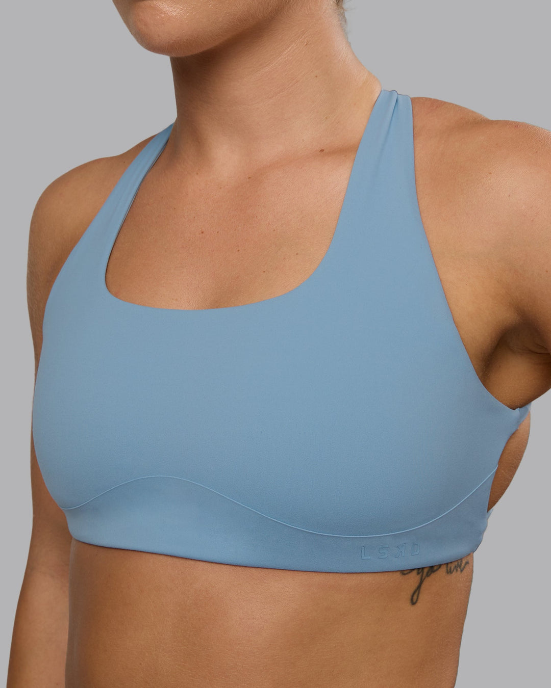 Woman wearing Aspire Sports Bra - Glacier Lake