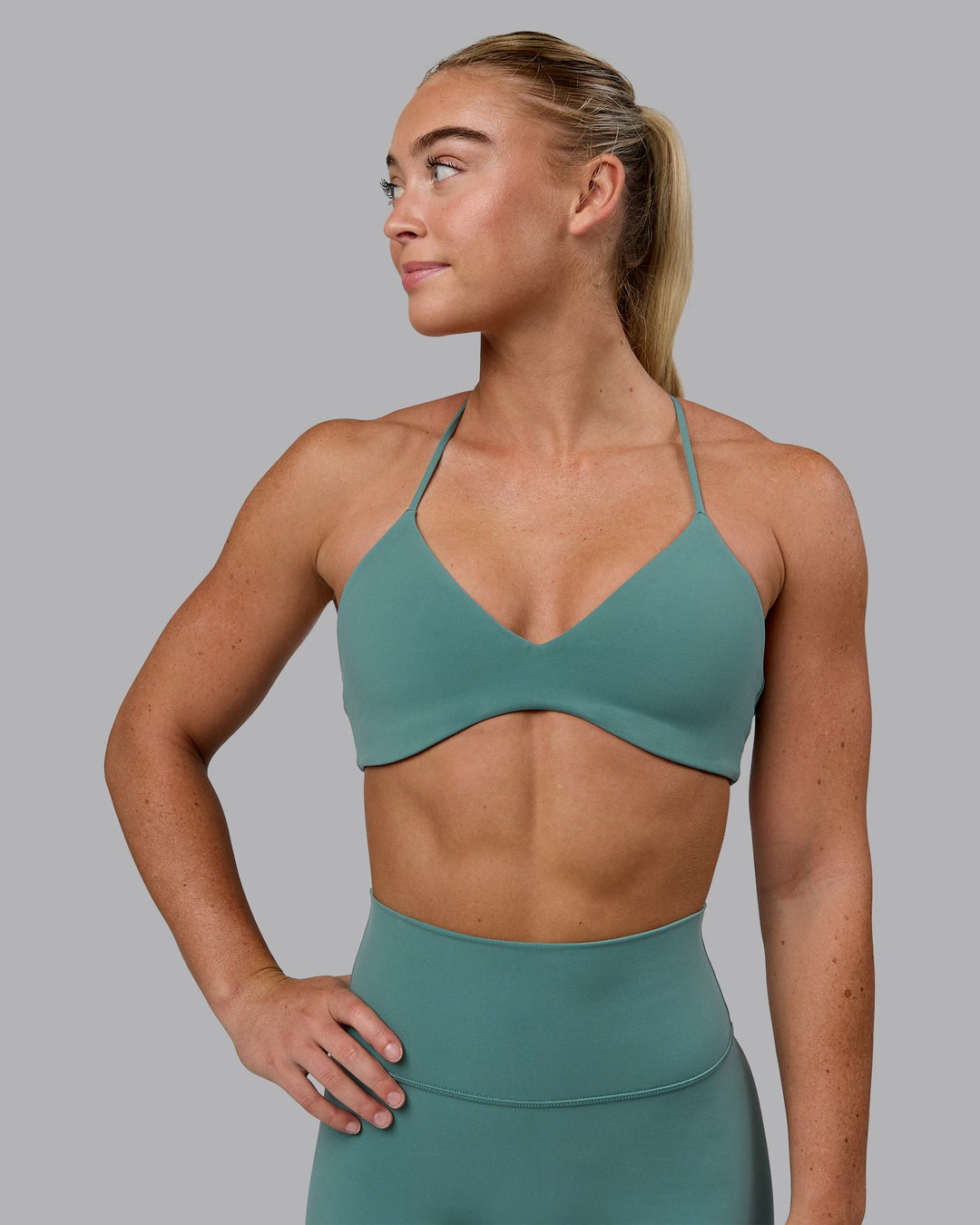 Woman wearing Aura Sports Bra - Sagebrush