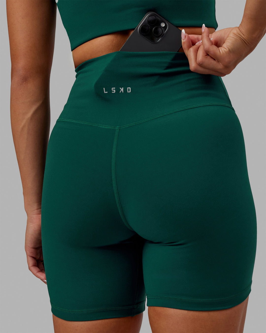 Woman wearing Base 2.0 Ultra High-Rise 6" Short - Dark Moss