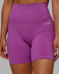 Woman wearing Base 2.0 Ultra High-Rise 6" Short - Hyper Violet
