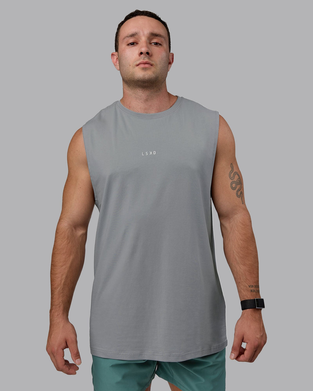 Man wearing Base FLXCotton Tank - Circular Grey