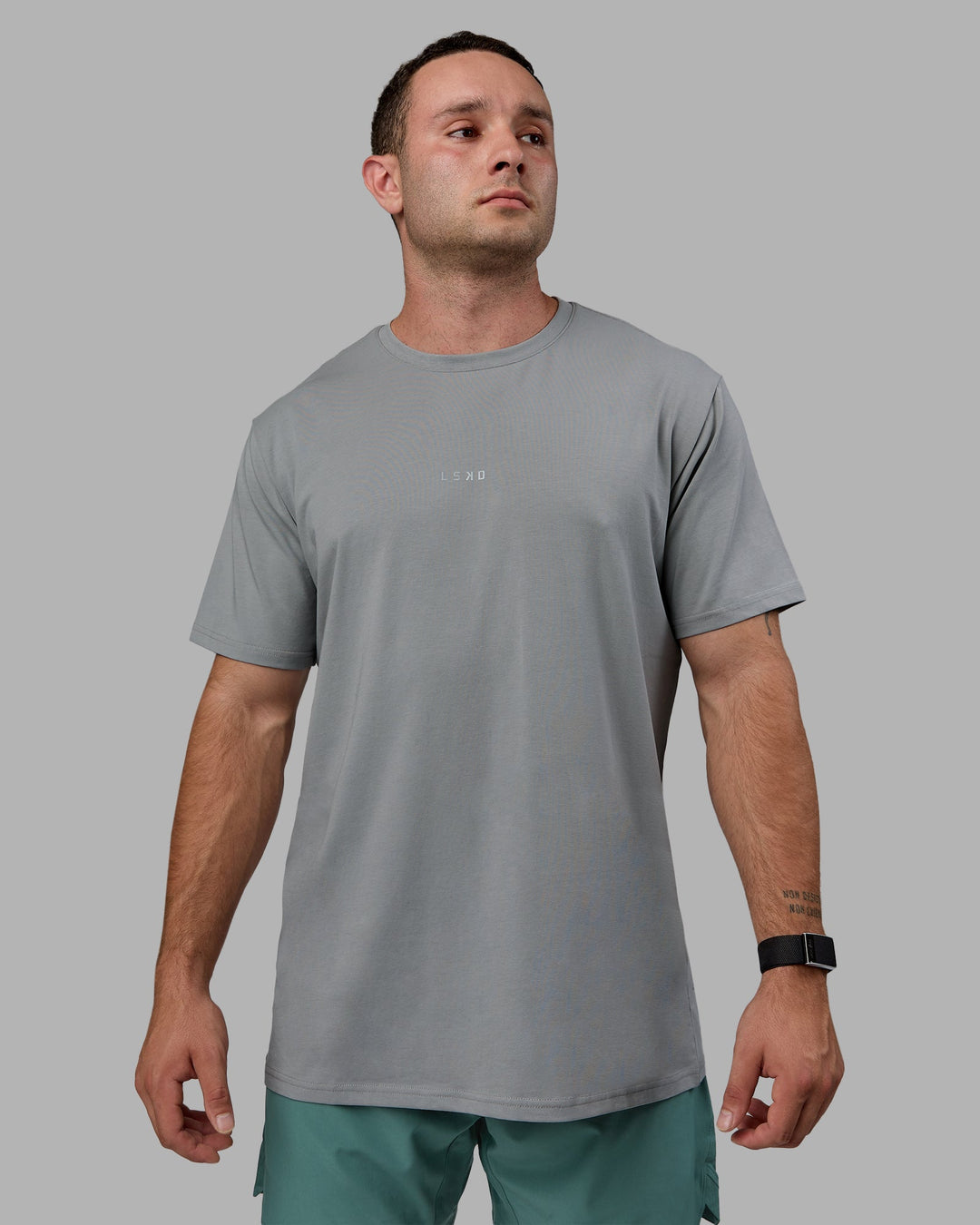 Man wearing Base FLXCotton Tee - Circular Grey