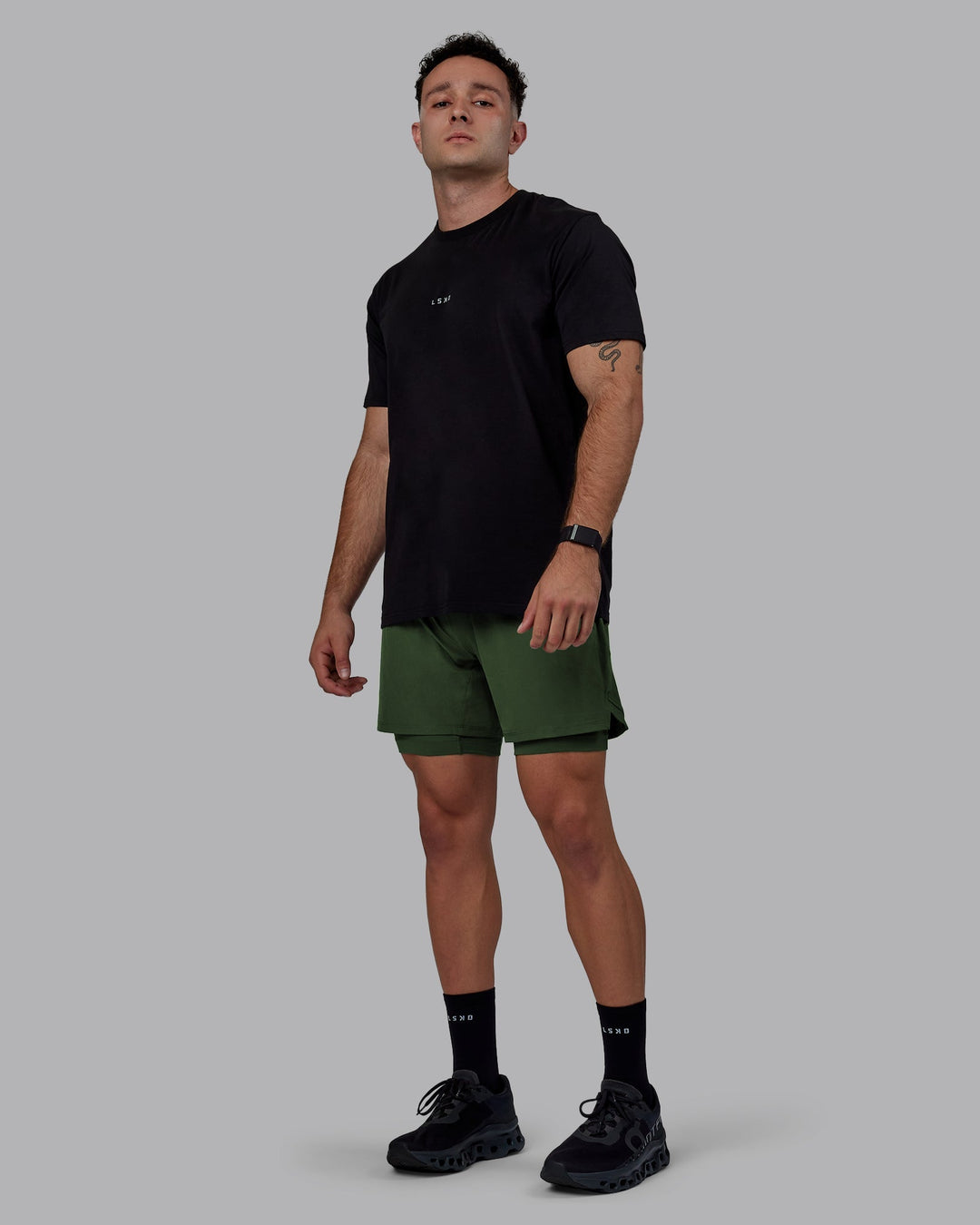 Man wearing Challenger 6&quot; Lined Performance Shorts - Cilantro