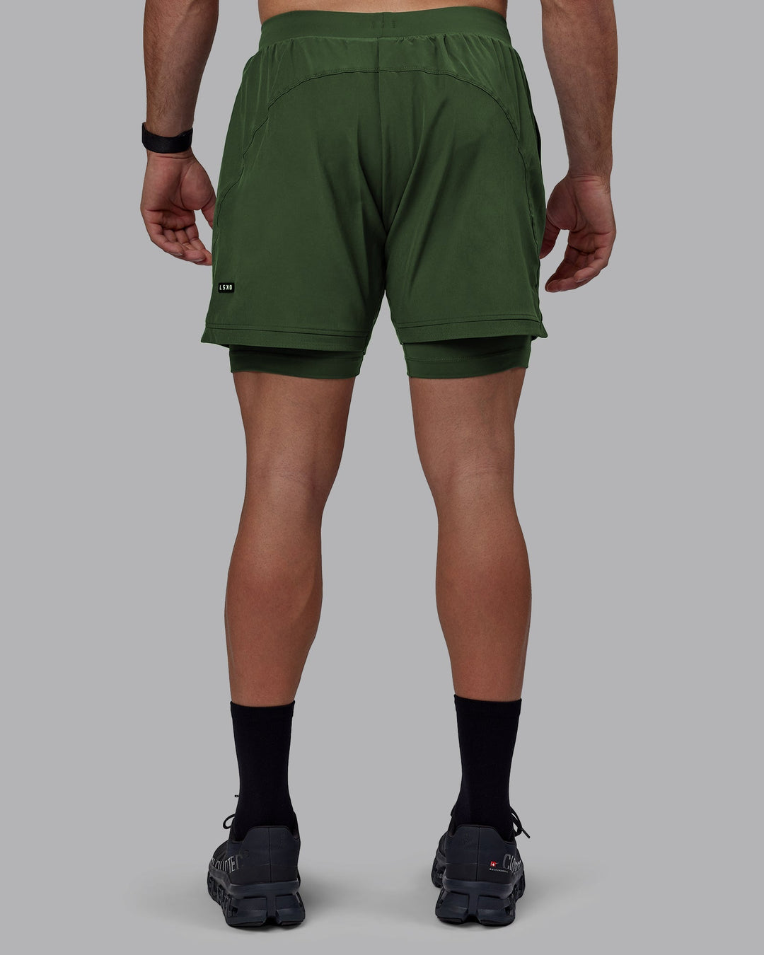 Man wearing Challenger 6&quot; Lined Performance Shorts - Cilantro