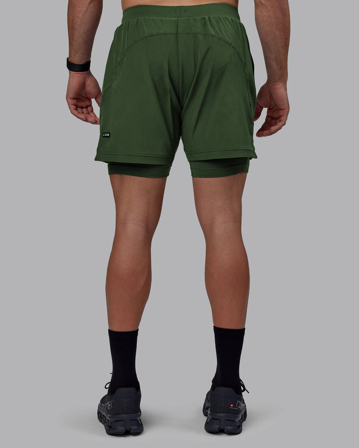 Man wearing Challenger 6&quot; Lined Performance Shorts - Cilantro
