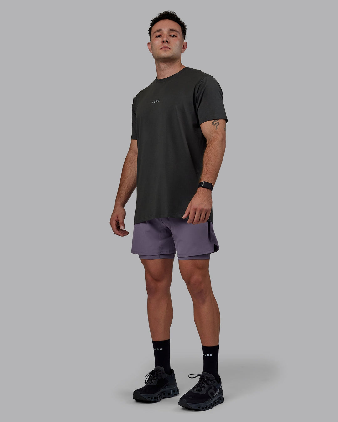 Man wearing Challenger 6&quot; Lined Performance Shorts - Purple Sage