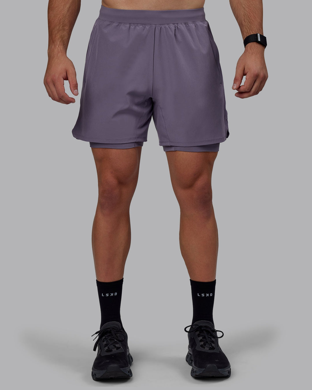 Man wearing Challenger 6&quot; Lined Performance Shorts - Purple Sage