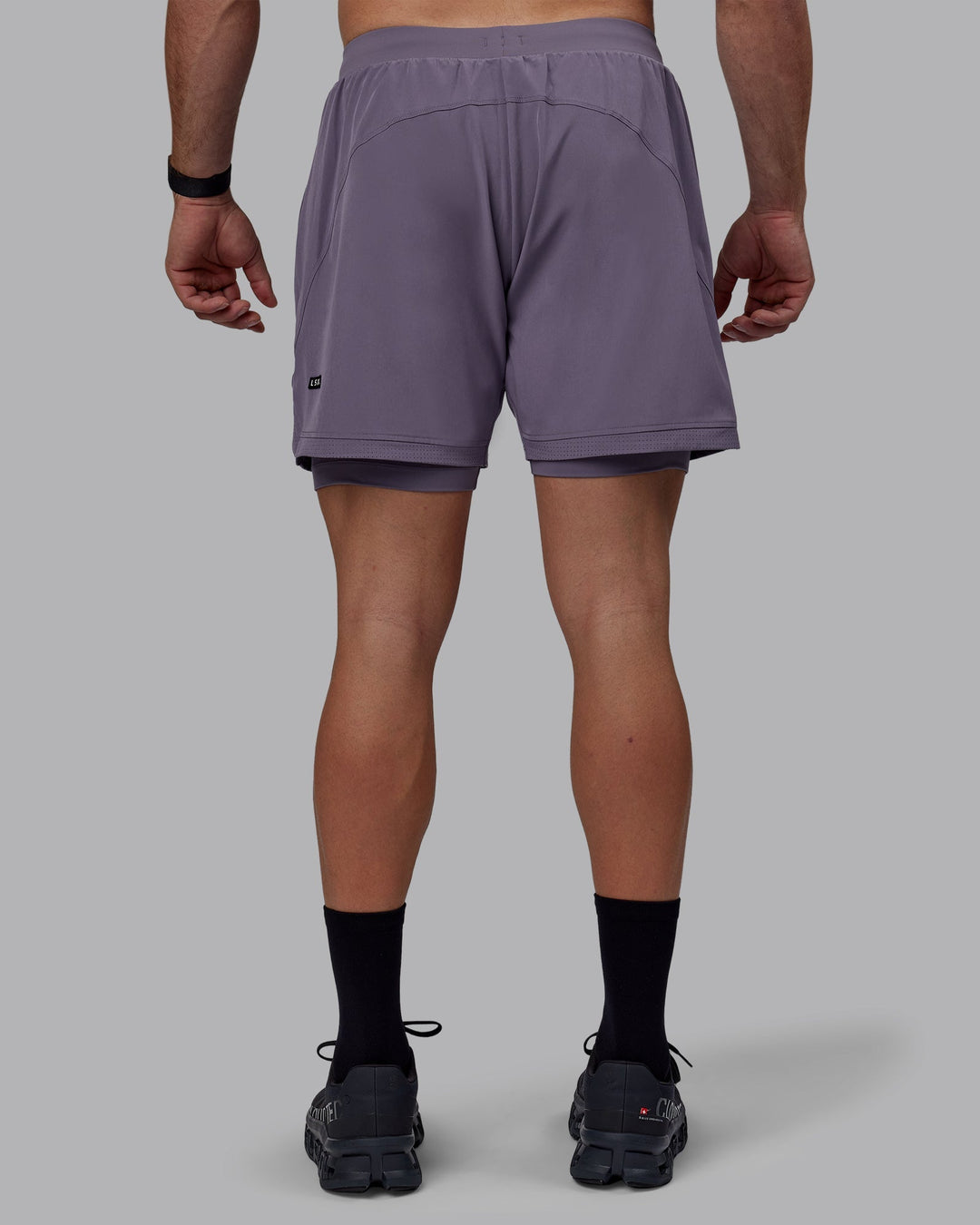 Man wearing Challenger 6&quot; Lined Performance Shorts - Purple Sage