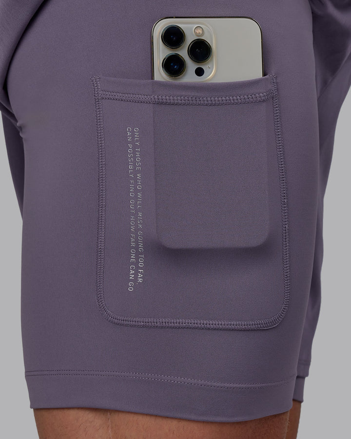 Man wearing Challenger 6&quot; Lined Performance Shorts - Purple Sage
