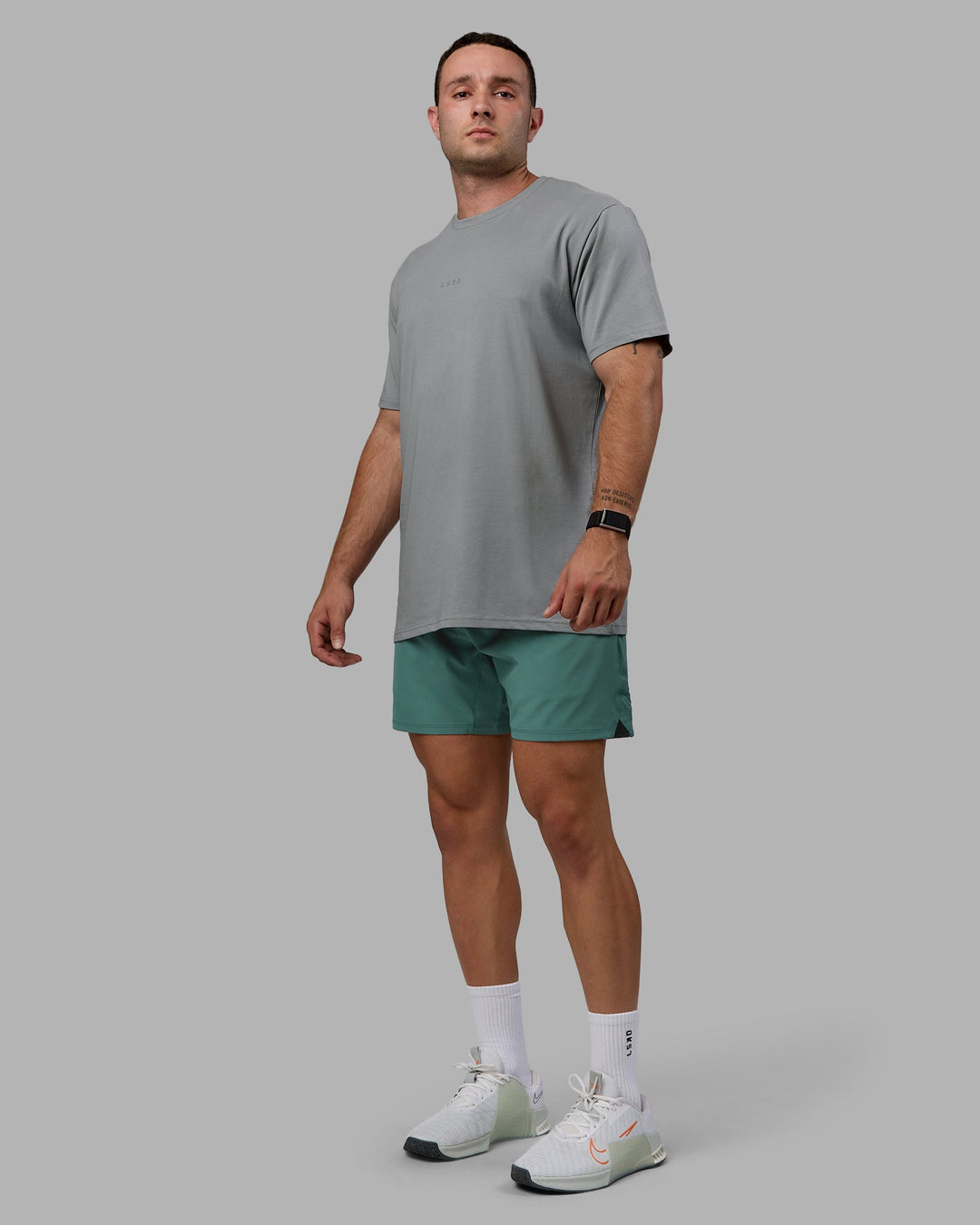 Man wearing Challenger 6&quot; Lined Performance Shorts - Sagebrush