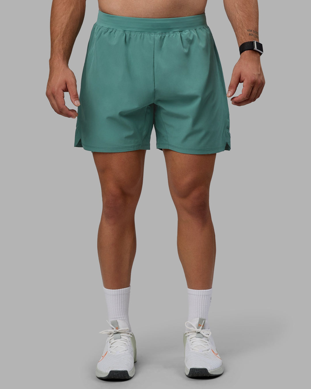 Man wearing Challenger 6&quot; Lined Performance Shorts - Sagebrush