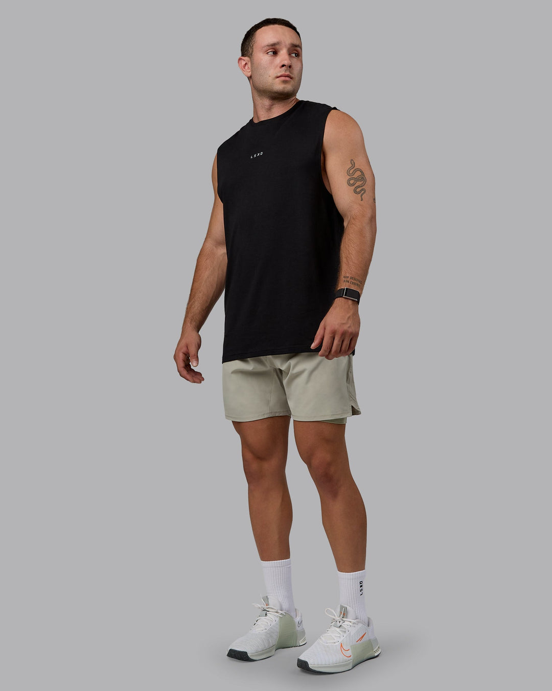 Man wearing Challenger 6&quot; Lined Performance Shorts - Sustained Grey