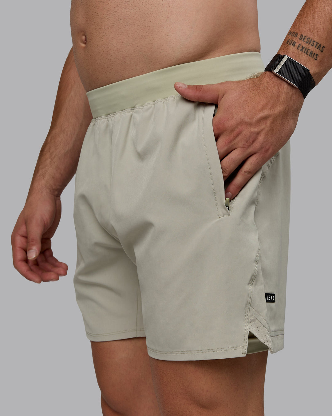 Man wearing Challenger 6&quot; Lined Performance Shorts - Sustained Grey