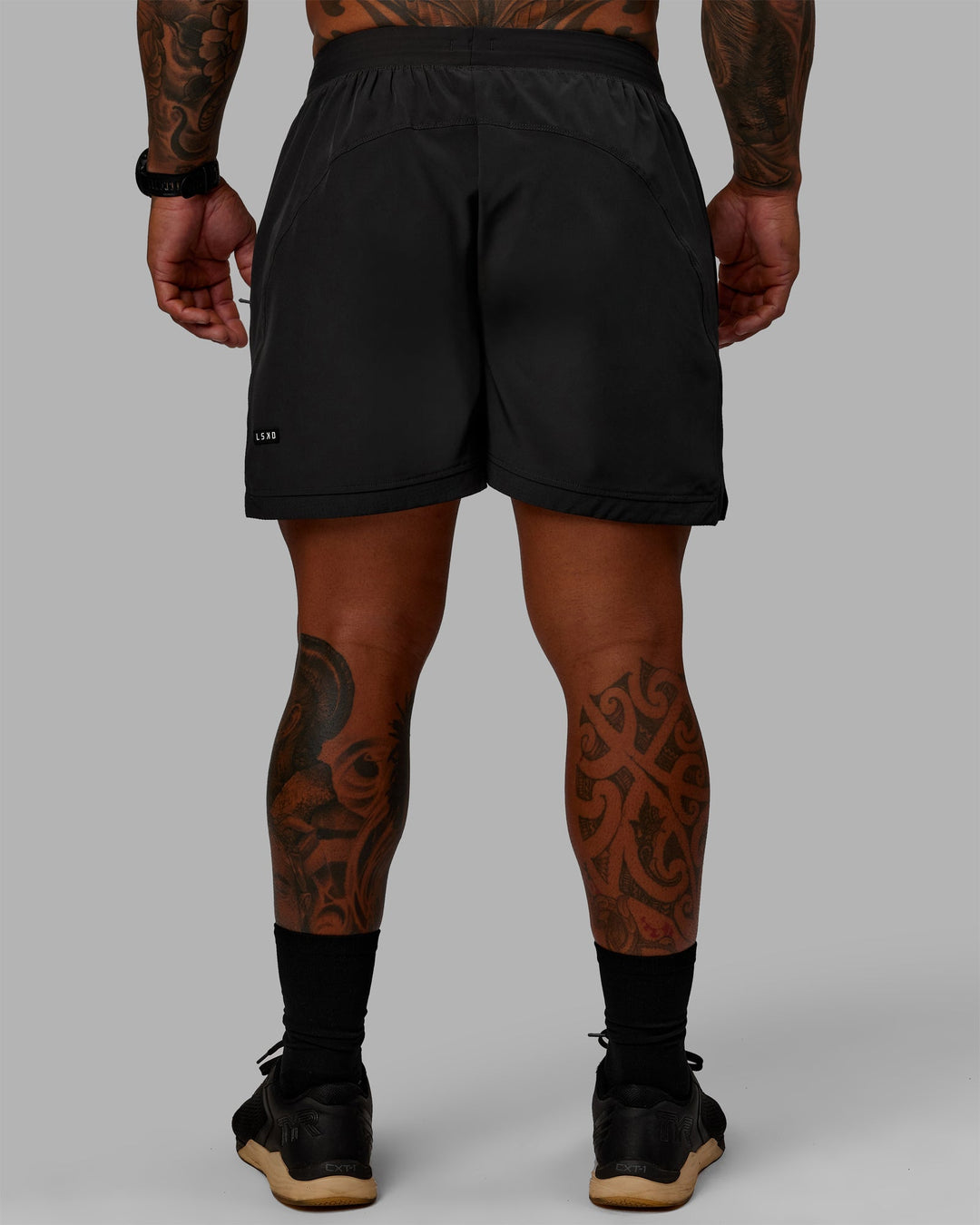 Man wearing Challenger 6" Lined Performance Shorts - Pirate Black