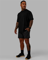 Man wearing Challenger 6" Lined Performance Shorts - Pirate Black