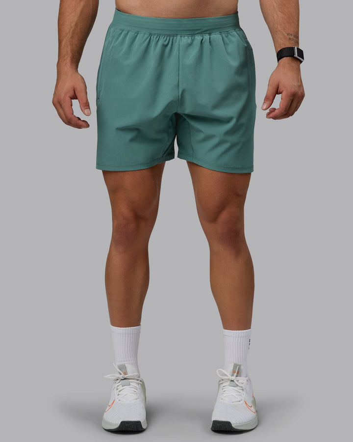 Man wearing Challenger 6&quot; Performance Shorts - Sagebrush
