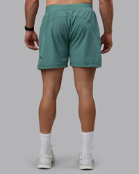 Man wearing Challenger 6" Performance Shorts - Sagebrush