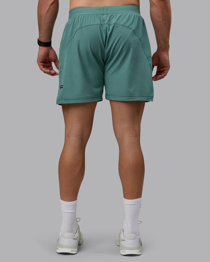 Man wearing Challenger 6&quot; Performance Shorts - Sagebrush
