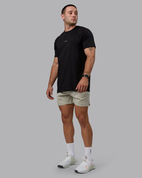 Man wearing Challenger 6" Performance Shorts - Sustained Grey